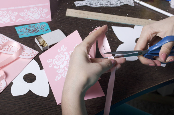 Making greeting cards from paper, cardboard and tape. Female artisan working with tape. - Zdjęcie, obraz
