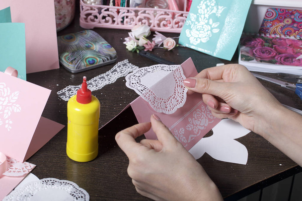 Making greeting cards from paper, cardboard and tape. Woman artisan at work. - Foto, Bild