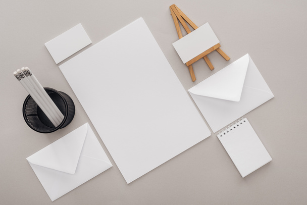 flat lay with blank cards and stationery on grey background - Photo, Image