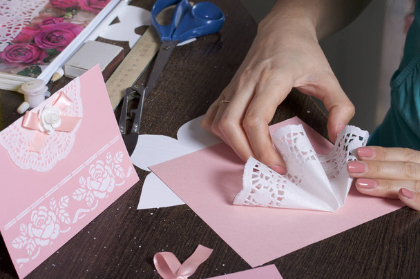 Making greeting cards from paper, cardboard and tape. Woman artisan at work. - Zdjęcie, obraz
