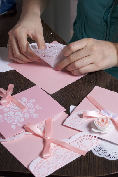 Making greeting cards from paper, cardboard and tape. Woman artisan at work. - Foto, imagen