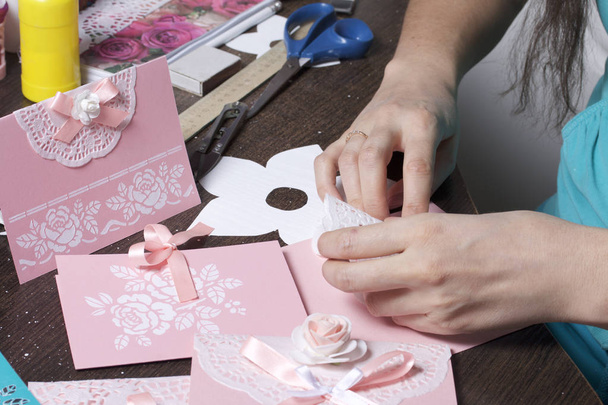 Making greeting cards from paper, cardboard and tape. Woman artisan at work. - Foto, Imagen