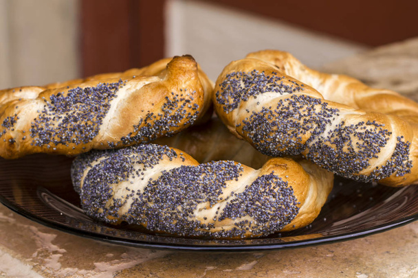Bagels with poppy seeds on plate - Photo, Image