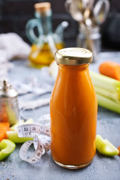 vegetable smoothie in bottle on a table - Photo, image