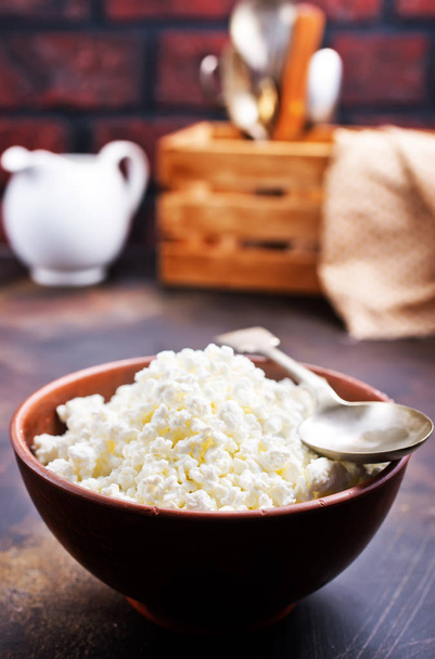 cottage cheese in bowl on a table - Fotoğraf, Görsel