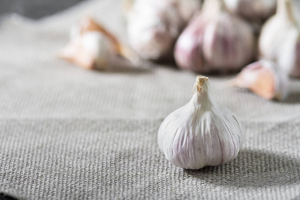 Garlic on fabric. Rustic style - Photo, image