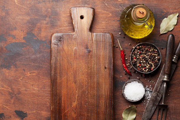 Various spices, herbs and cooking utensils on wooden background. Top view with space for your recipe. Flat lay - Φωτογραφία, εικόνα