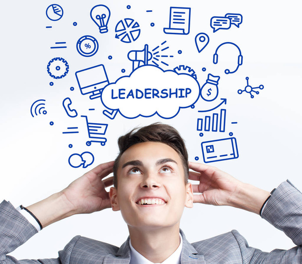 Business, technology, internet and networking concept. The young entrepreneur thought: leadership - Foto, Imagen