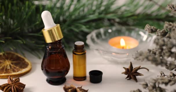 spa and wellness - organic essential oils with aromatic plants and candle - Footage, Video