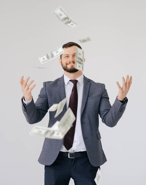 Businessman in suit portrait. Scattering money - Фото, зображення
