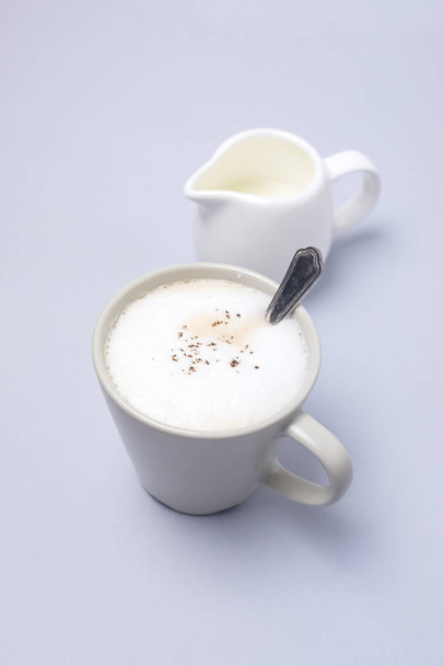 Tasty Cappuccino Cup of Cappuccino Coffee Milk Cream Vertical Blue Background - Фото, зображення