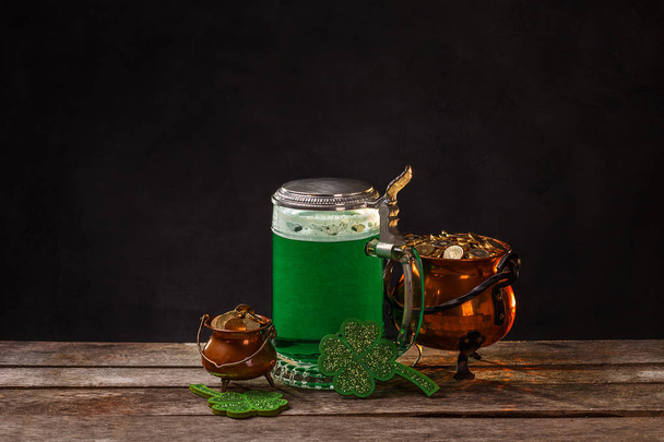 St Patrick's Day concept with green beer and pot of gold, space for your text - Photo, image