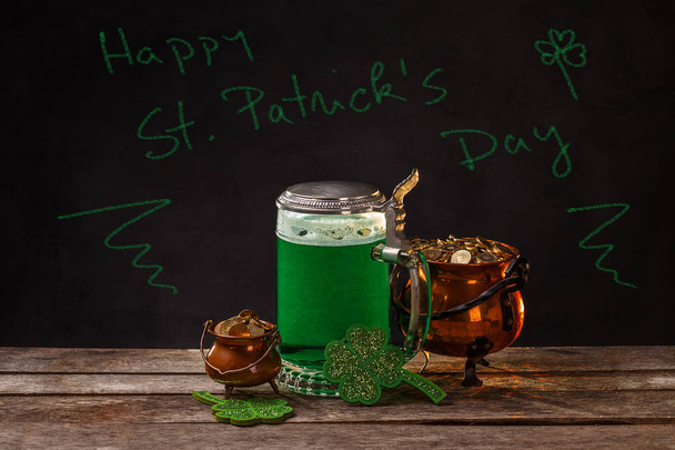 Happy St. Patrick's Day chalk text with green beer, shamrock and coins - Фото, зображення