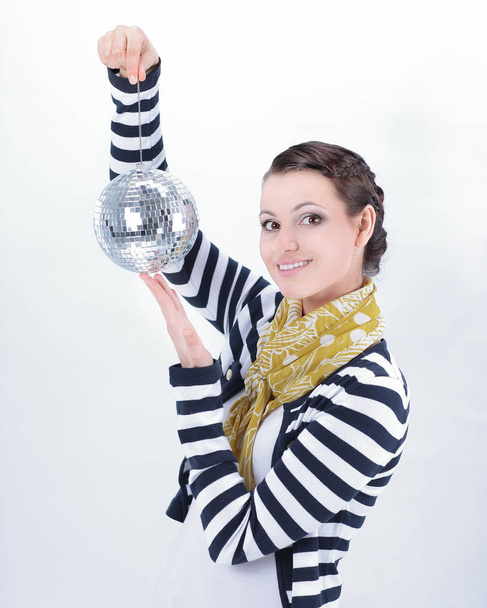 pretty young woman holding a mirror ball.isolated on white background - Foto, afbeelding