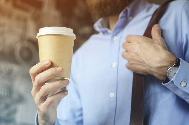 Businessmen drink coffee. Paper Cup Hand Clock Shirt Beard. Office Coffee Break Concept - Foto, afbeelding