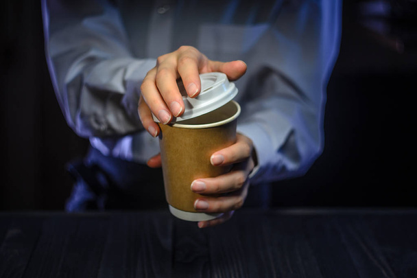Barista serves coffee to the client. Hands Paper cup Bar counter Cappuccino Plastic cap. Coffee Business Concept - Fotó, kép