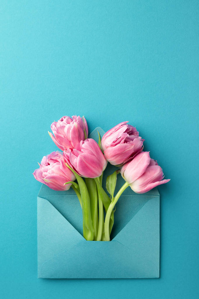 Pink tulips in envelope. - Fotó, kép