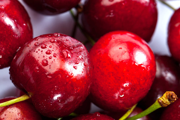 Close up view of cherries with water drops. Macro background. - Foto, afbeelding