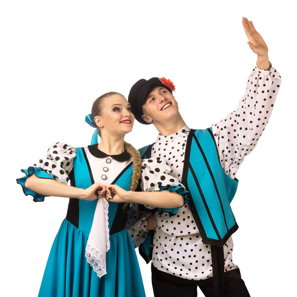 Beautiful caucasian couple dancing in Russian folk costumes isolated on white background - Fotoğraf, Görsel
