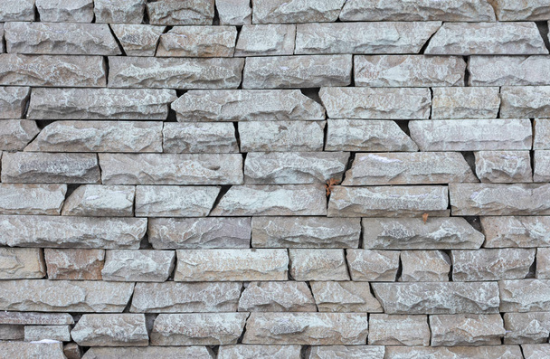 Patroon van de lichte moderne stenen muur of ruwe gestructureerde achtergrond - Foto, afbeelding