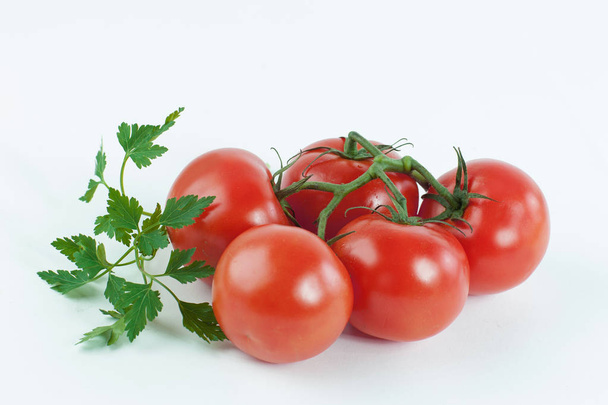 ripe tomatoes on a branch .isolated white background. - Foto, Bild