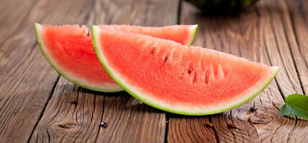 Fresh ripe watermelon on wooden background - Fotó, kép