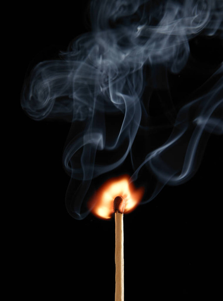 MATCH FLAME AND SMOKE ON BLACK BACKGROUND - Foto, Imagem