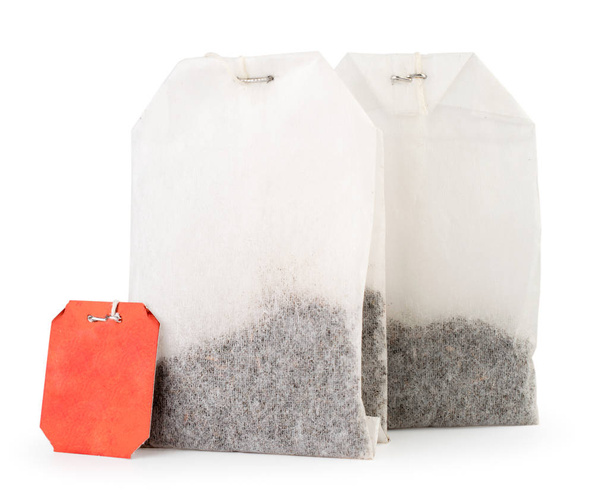 Two tea bags close up on a white. Isolated. - Photo, Image