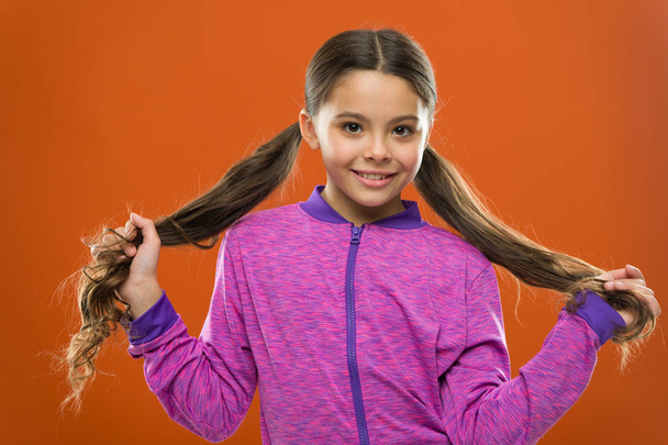 childrens day. Portrait of happy little child. Happy little girl with long hair. Kid fashion and sportswear. Small girl child. Hairdresser for kids. childhood happiness. Family. Summer fun - Φωτογραφία, εικόνα