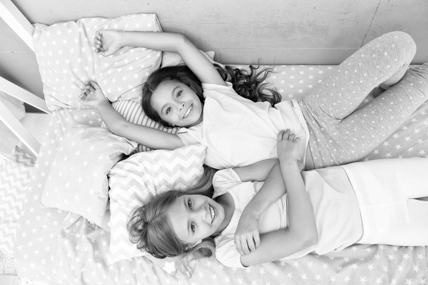 comfort. home comfort for small girls. small girls are happy together. enjoying time at home. - Photo, image