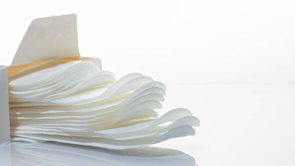 Hygienic daily ultra-thin panty liners on a white background Close up - Valokuva, kuva