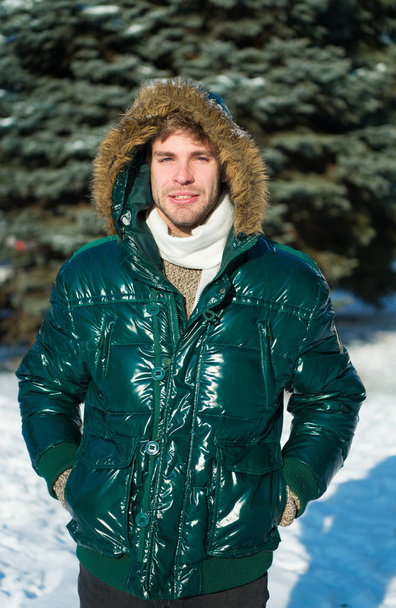 Winter fashion. Warm clothes. man on winter holidays. Snowy weather. Trendy winter coat. Vacation and traveling in winter. Man. It is cold outside. Forest in snow. Fresh air. It is so cold - Foto, immagini