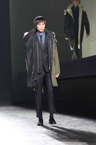 Дефиле Dior Homme Winter 2014 в Шанхае, Китай, 18 апреля 2014 года
. - Фото, изображение
