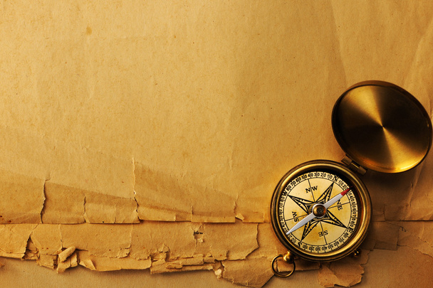 Antique brass compass over old background - Foto, Imagem