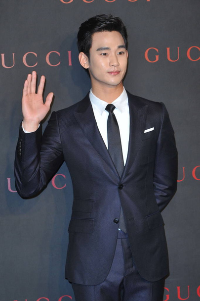 South Korean actor Kim Soo-hyun waves during the reopening ceremony for the Gucci boutique at Shin Kong Place in Beijing, China, 8 April 2014. - Valokuva, kuva