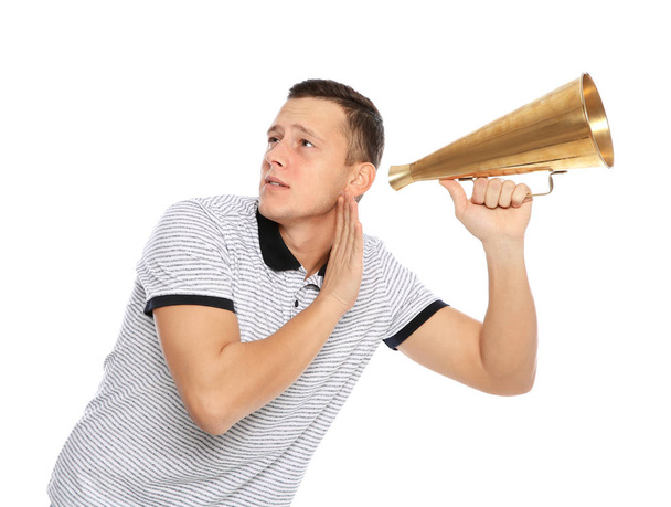 Emotional young man with megaphone on white background. Space for text - Fotoğraf, Görsel