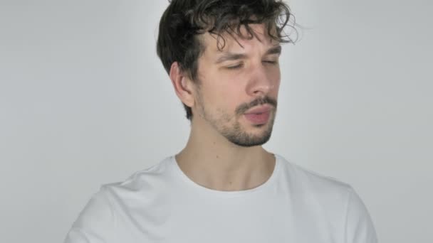 Young Casual Man Listening Secret, White Background - Metraje, vídeo
