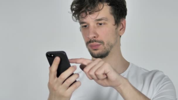 Young Casual Man Reacting to Loss while Using Smartphone - Filmmaterial, Video