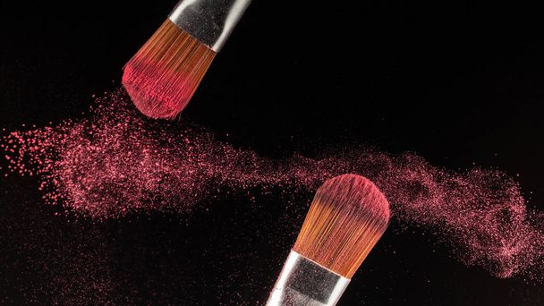 powder splash and brush for makeup artist or beauty blogger in black background - Photo, Image