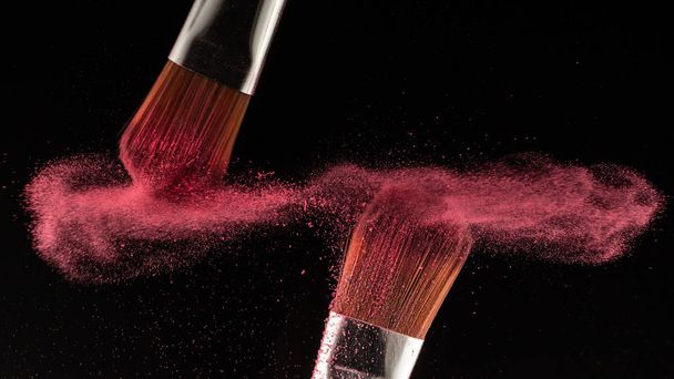 powder splash and brush for makeup artist or beauty blogger in black background - Photo, image