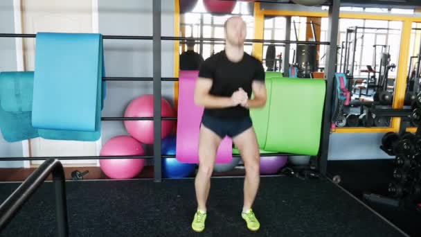 Man does the warm-up. A young crossfit athlete prepares for training. - Footage, Video