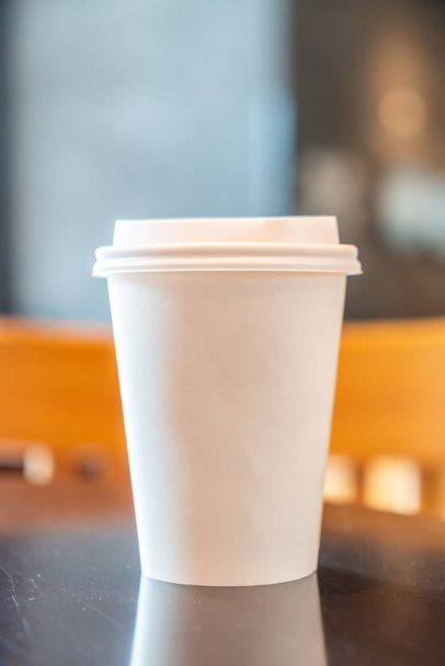 hot coffee paper cup in coffee shop and cafe - Photo, Image