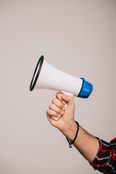 cropped view of man holding megaphone, isolated on grey - Photo, image