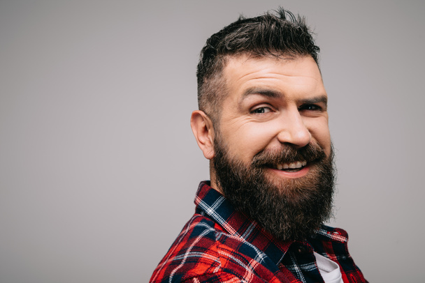 happy bearded man in checkered shirt isolated on grey - Фото, зображення