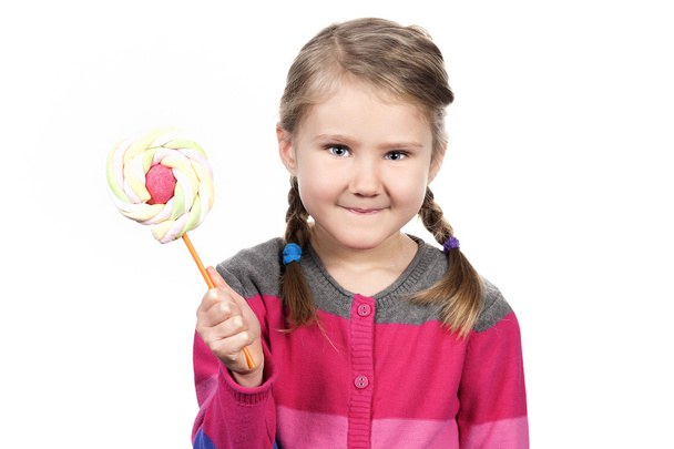 Cute girl with lollipop - Foto, afbeelding