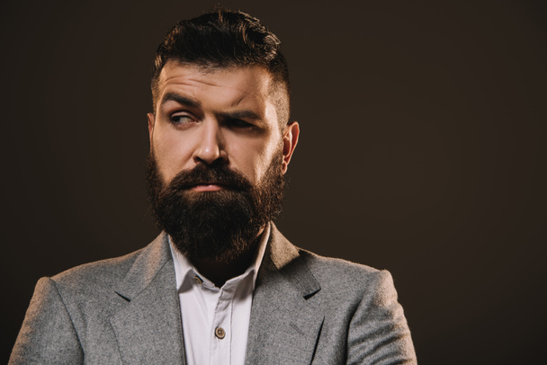 brunette beard businessman thinking isolated on brown - Φωτογραφία, εικόνα