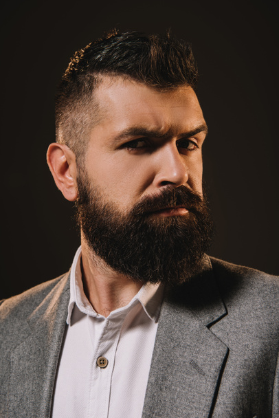 handsome beard businessman thinking isolated on brown - Foto, immagini