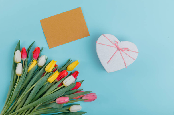 Postcard for Women's Day. Spring tulips frame on background, top view. - Zdjęcie, obraz