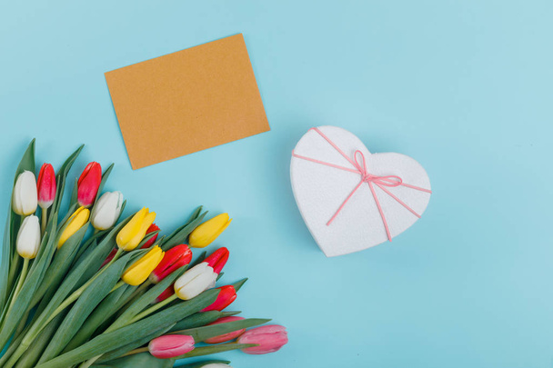Women's Day greeting card template. Spring tulips frame on background, top view. Women's Day or Mother's Day or Sale concept. - Photo, image