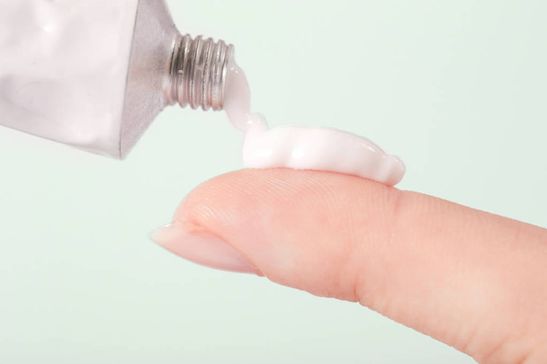 Close up image of hands with cream tube - Foto, imagen